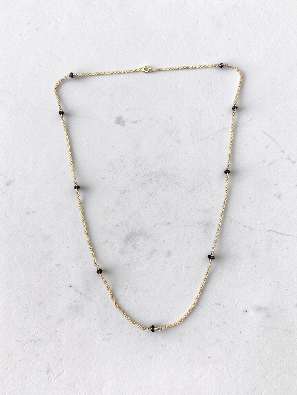 Delicate Gold Necklace with Deep Red Garnet Bead Stations